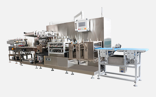 Medical dressing adhesive molding and packaging machine